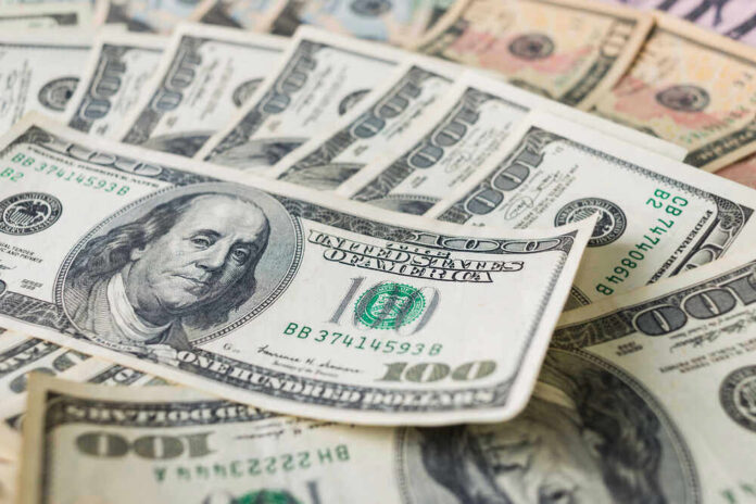 Stacks of various U.S. paper money