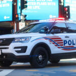 Prosecution Rattles Every Cop in America Police SUV with lights on in an urban environment