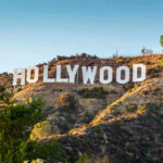Melania Film SHOCKS Hollywood Elites Hollywood Sign on a green hillside, sunny day.