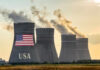 Cooling towers with USA flag and smoke clouds