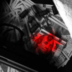 A gun, cash, and a bag of white powder arranged on a dark surface