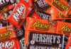 An assortment of chocolate candy bars including Kit Kat, Reese's, and Hershey's