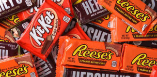 An assortment of chocolate candy bars including Kit Kat, Reese's, and Hershey's