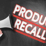 Amazon Import BANNED and RECALLED Megaphone and Product Recall text on chalkboard.