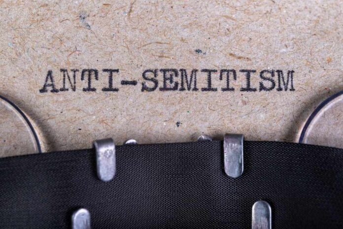 Typewritten text reading 'ANTI-SEMITISM' on a textured background