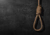 BREAKING: Hanging Becomes Default Punishment A noose made of rope hanging against a dark textured background