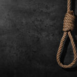 BREAKING: Hanging Becomes Default Punishment A noose made of rope hanging against a dark textured background
