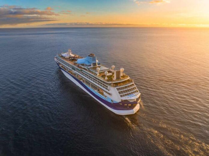 A cruise ship sailing on calm waters during sunset