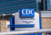 CDC building sign in front of structure.