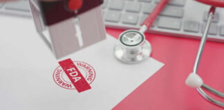 FDA warning stamp near stethoscope and keyboard