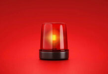 Red emergency light on red background