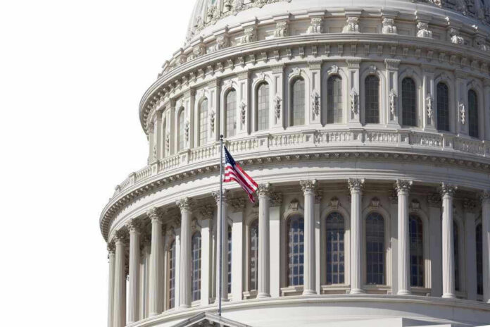U.S. Capitol dome with American flag flying.