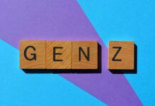 Wooden letter blocks spelling 'GENZ' on a colorful background