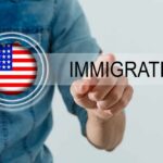 A person pointing at the word 'IMMIGRATION' with an American flag graphic