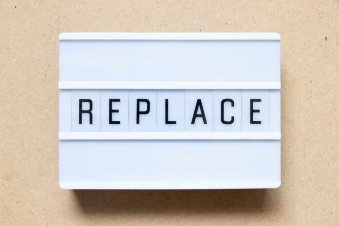 Lightbox sign displaying the word 'REPLACE'