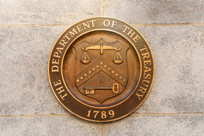 shutterstock_2272426623.jpg Department of the Treasury seal on stone wall