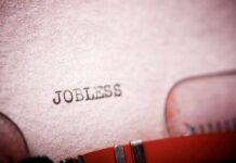 Close-up of a typewriter with the word 'JOBLESS' typed on paper