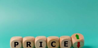 Wooden blocks spelling 'PRICE' with arrows indicating increase and decrease