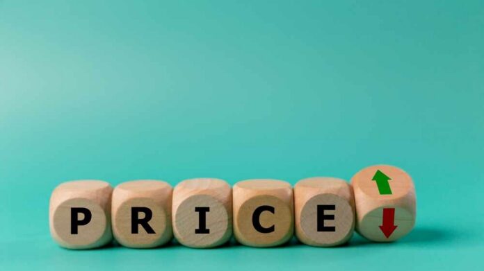 Wooden blocks spelling 'PRICE' with arrows indicating increase and decrease