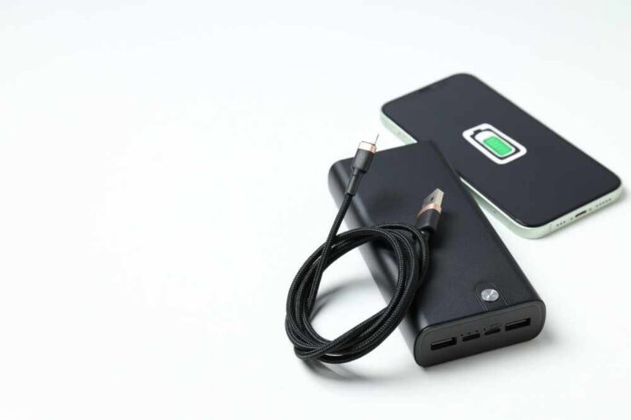 A portable charger and smartphone with a charging cable
