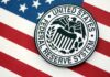 Federal Reserve System emblem on an American flag background