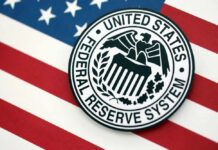 Federal Reserve System emblem on an American flag background