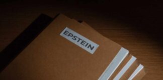 Stack of brown file folders labeled 'EPSTEIN'