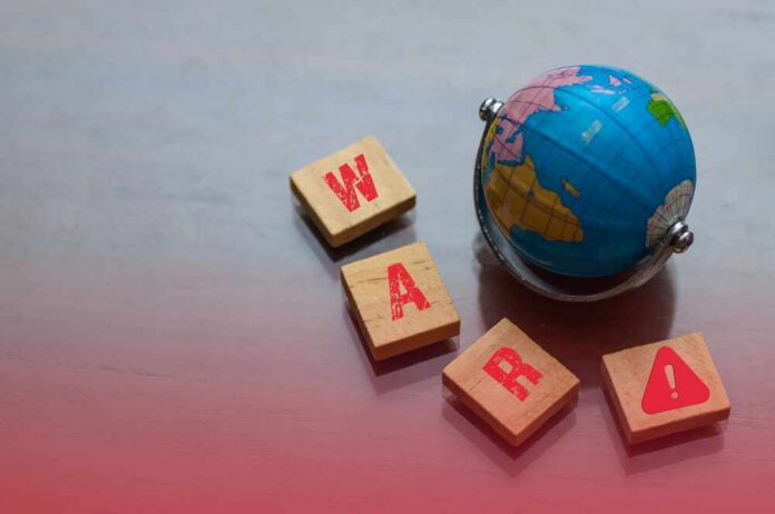 A small globe next to wooden blocks spelling 'WAR' with a warning symbol
