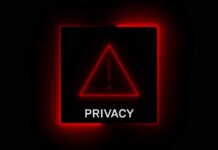 A red neon privacy warning sign with an exclamation mark