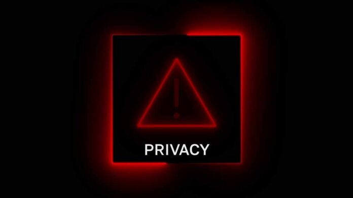 shutterstock_2756122683.jpg A red neon privacy warning sign with an exclamation mark