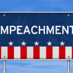 Sign displaying the word 'IMPEACHMENT' with a patriotic design