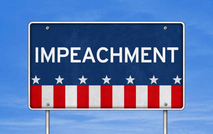 shutterstock_642738976.jpg Sign displaying the word 'IMPEACHMENT' with a patriotic design