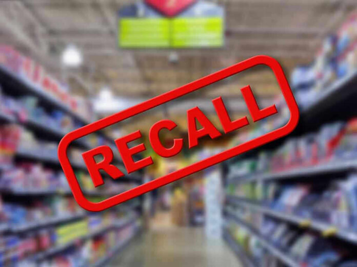 Blurred store aisle with RECALL stamp overlay.