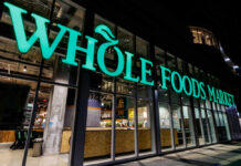 Exterior view of a Whole Foods Market store at night