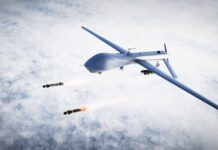 Military drone releasing missiles in the sky