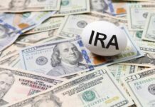 An egg labeled 'IRA' placed on a pile of U.S. dollar bills