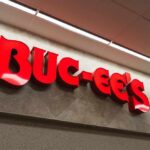 Mega Buc-ee’s Push Redraws Map Bright red Buc-ee's store sign on a wall