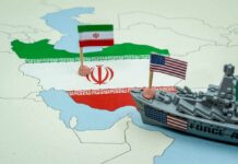 A map of Iran with flags of Iran and the United States and a toy military ship
