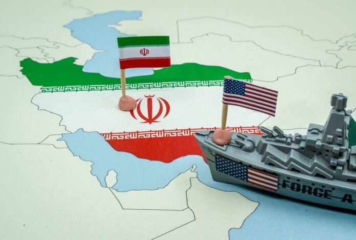 A map of Iran with flags of Iran and the United States and a toy military ship
