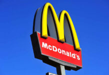 McDonalds logo on a pole clear sky