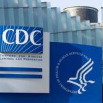 Signage of the CDC building displaying its name and logo