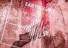Seismograph showing earthquake amplitude on a cracked wall