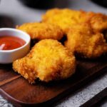Nostalgia Play Sparks Nugget Frenzy Crispy fried chicken pieces served with a small bowl of ketchup
