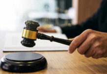 Judge Caught Aiding ICE Escape — Career Over Gavel in judges hand about to strike.