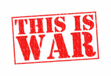 A bold red stamp with the text 'THIS IS WAR'