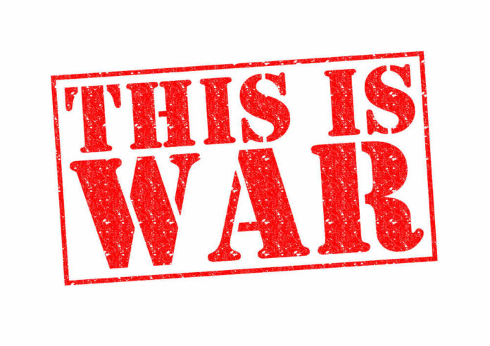 This,Is,War,Rubber,Stamp,Over,A,White,Background. A bold red stamp with the text 'THIS IS WAR'