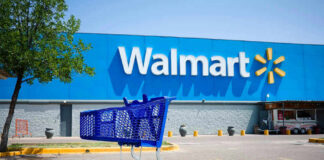 Shopping cart in a Walmart parking lot.