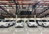 Car Payments Explode — Is THIS The New ‘Normal’ White Tesla cars displayed in showroom with Tesla sign.