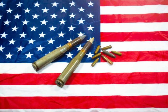 American,Flag,With,Bullets,,Shells,,Cartridges,And,Projectiles,On,It.