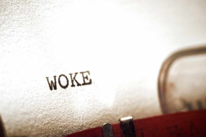 Woke,Word,Written,With,A,Typewriter. Close-up of the word WOKE typed on paper from a typewriter